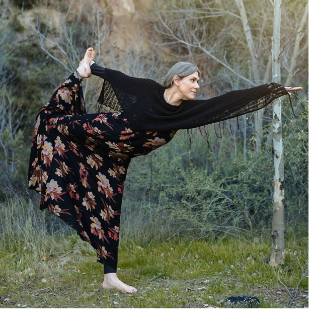 Danica Lynch balances on one foot in a yoga pose