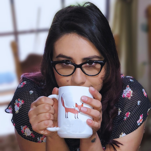 Jax Skorich drinking from a mug of coffee