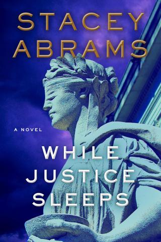 Book cover of While Justice Sleeps. A picture of Lady Justice with a purple sky in the background. 